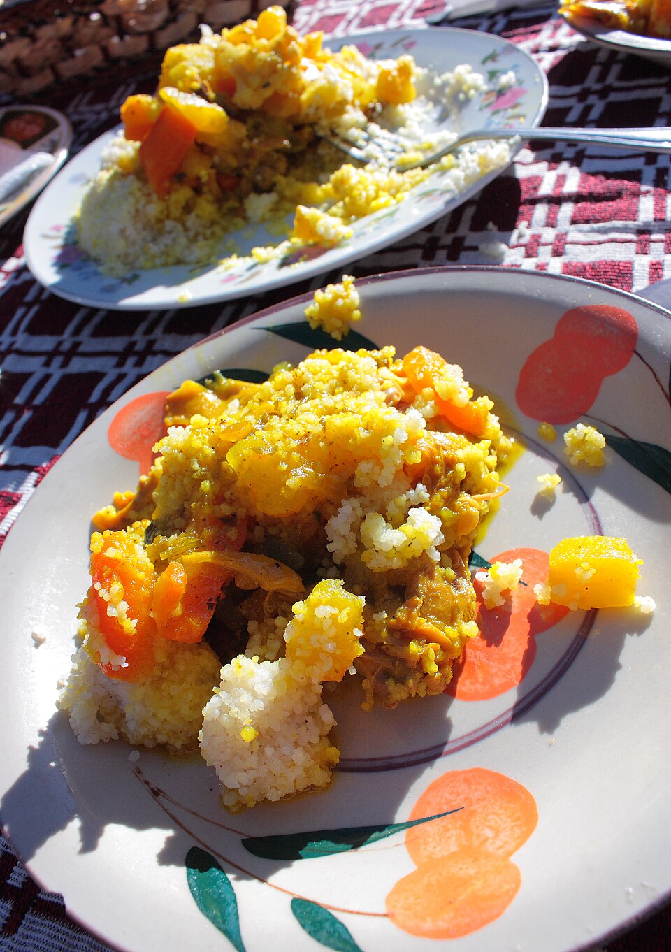 Couscous - Von Evan - CC BY 2.0, https://commons.wikimedia.org/wiki/File:Chicken_Orange_Couscous-01.jpg